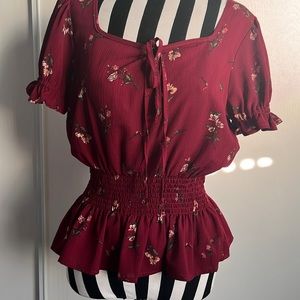 Burgundy flower top with cinched elastic waist